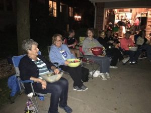 Neighbors gather to visit and pass out candy!